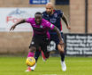 Ross County's Liam Fontaine (right)