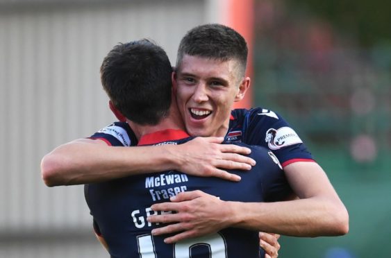 Ross County's Brian Graham (L) celebrates at full time with teammate Ross Stewart