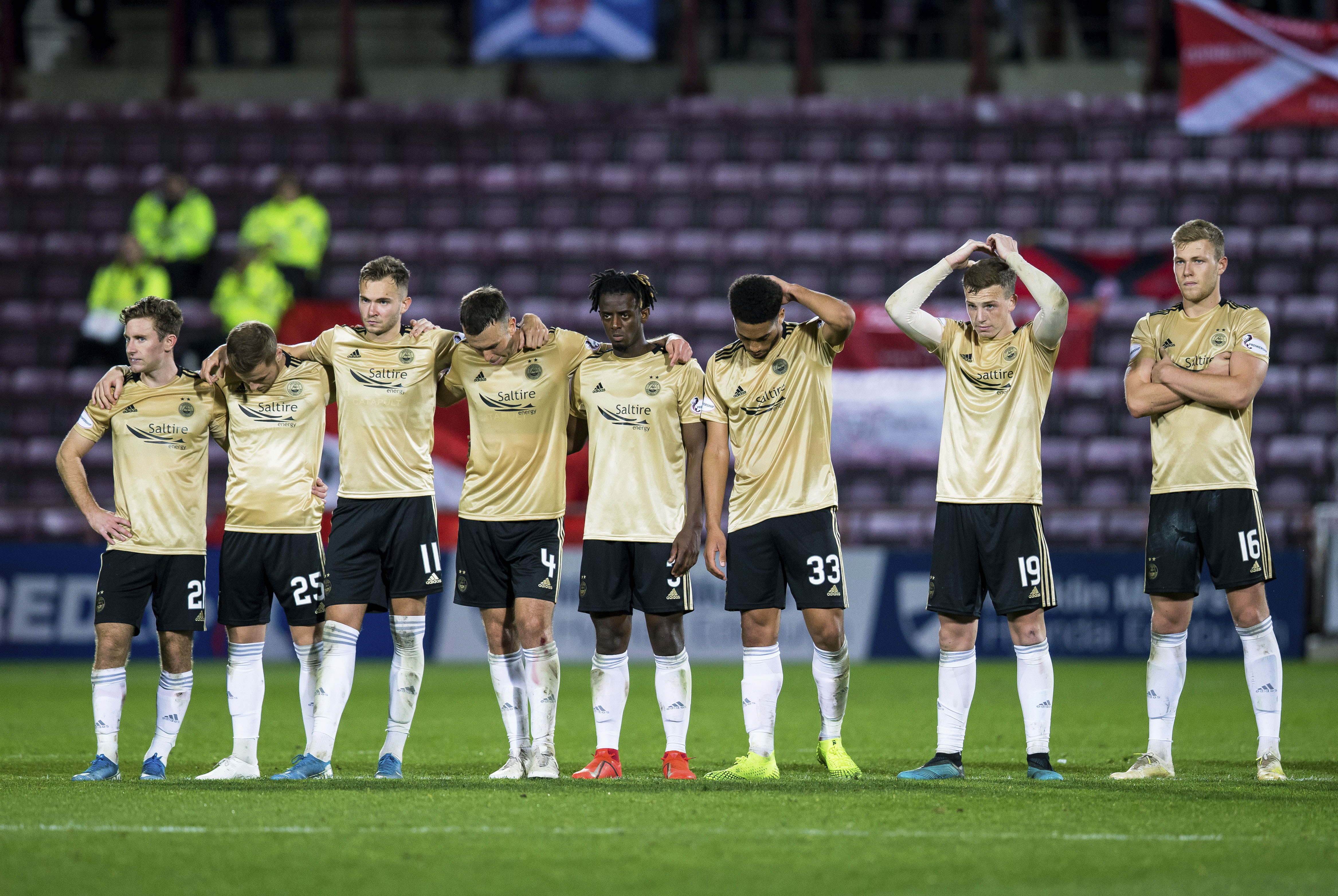 Aberdeen players look dejected at full time of the Betfred Cup defeat to Hearts.