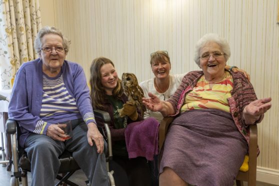 Pictured are residents Dorothy Donald and Marion Jaffray, with Jessica Morrison from Speyside Falconry Centre and Tor-Na-Dee team member Lotte Grooby.