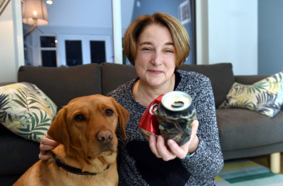 Marion Montgomery with her Labrador, Paddy. Picture by Darrell Benns