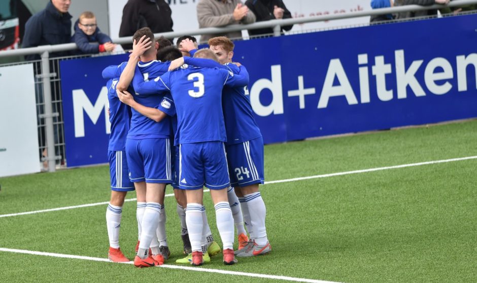 Players celebrate Cove's second goal scored by Matthew Smith.
Picture by COLIN RENNIE