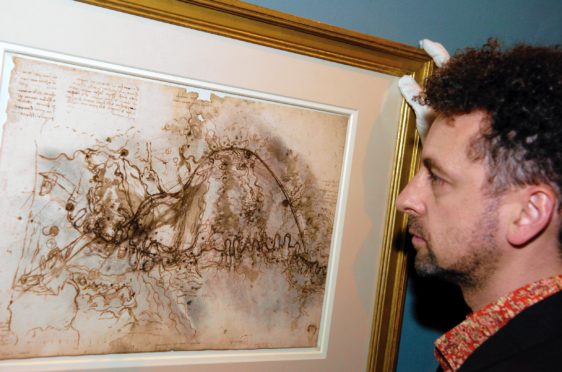An exhibition of 10 of Leonardo Da Vinci's finest drawings on loan from the Royal Collection in 2006 at Aberdeen Art Gallery. 
Martin Clayton, deputy curator of the print room at Windsor Castle, is seen looking at one of the drawings. 
Taken by Raymond Besant.