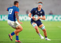 Jamie Ritchie of Scotland runs with the ball under pressure by Alapati Leiua of Samoa during the Rugby World Cup 2019 Group A game between Scotland and Samoa at Kobe Misaki Stadium