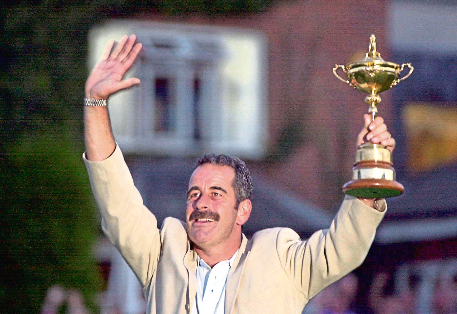 Europe's team captain Sam Torrance holds up the Ryder Cup after the presentation at the Belfry, near Sutton Coldfield following his team's defeat of the USA.
