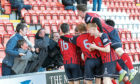 Kane Hester is congratulated by supporters and team-mates.