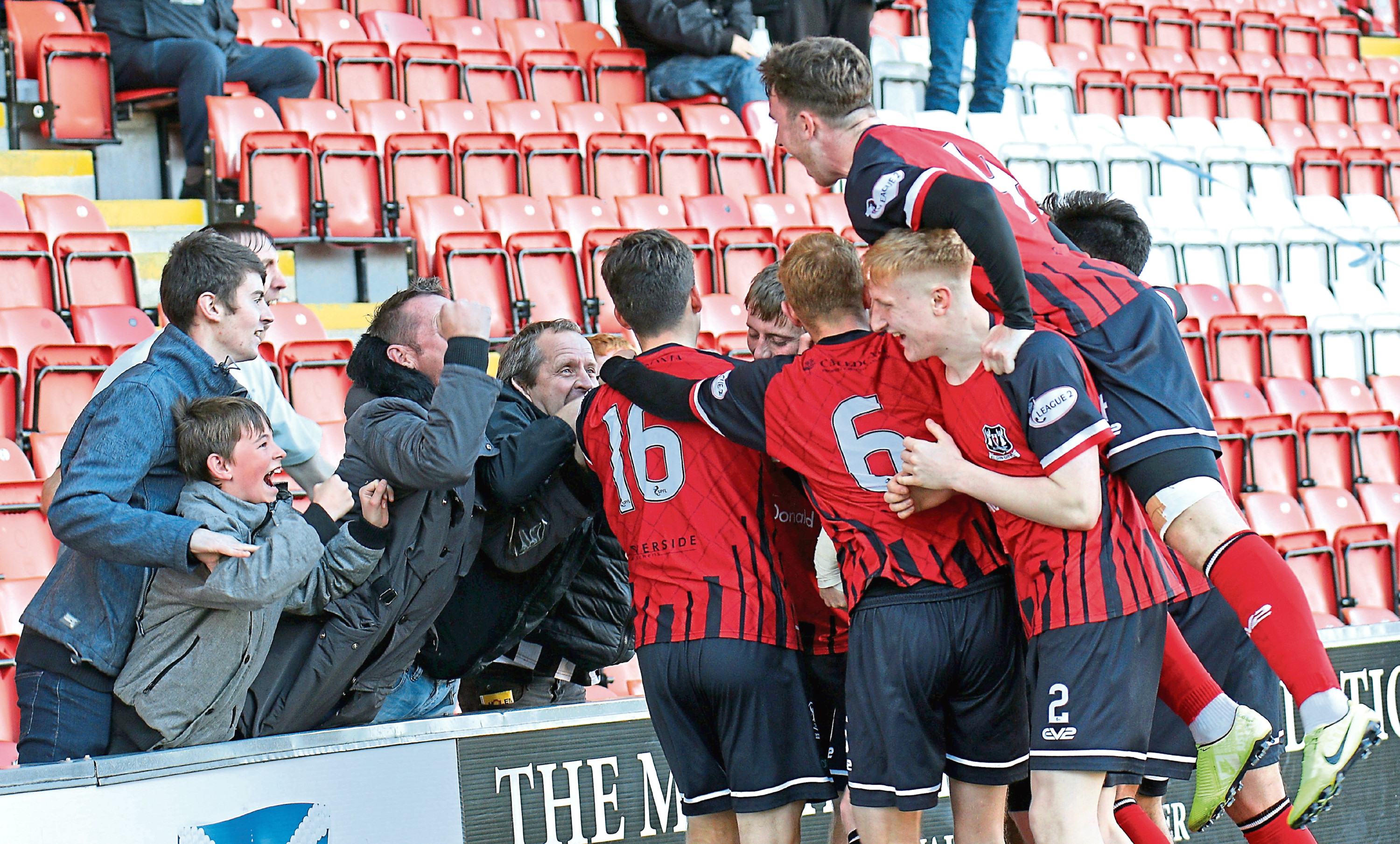 Kane Hester is congratulated by supporters and team-mates.