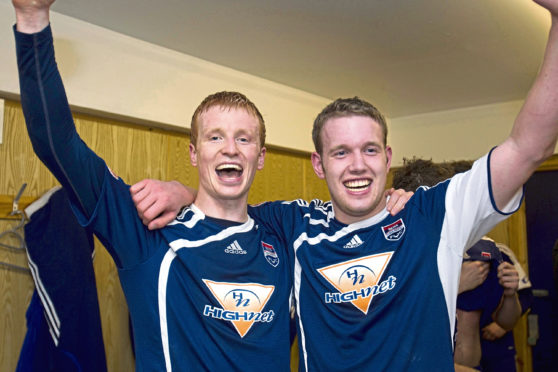 Ross County's Scott Boyd and Garry Wood celebrate in the dressing room following victory over Hibernian in the Scottish Cup Sixth Round Replay in 2010