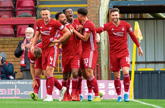 Zak Vyner celebrates his goal with his team mates.