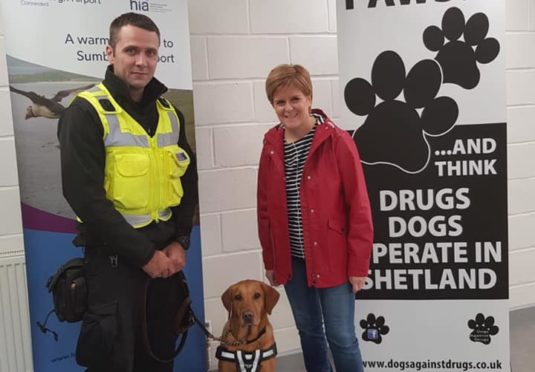 Ewan and Blade on duty at Sumburgh Airport with First Minister Nicola Sturgeon.