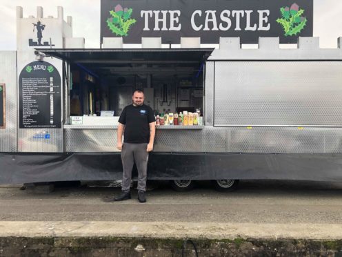 Ashley Forbes outside his food van.