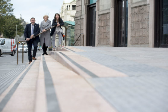 Councillor Jenny Laing, Councillor Douglas Lumsden, Councillor Marie Boulton outside the Aberdeen Art Gallery.