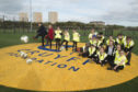 Aberdeen City Council Co-Leaders Cllr Jenny Laing and Cllr Douglas Lumsden join pupils of Tullos Primary School in trying out the new Cruyff Court Neale Cooper.