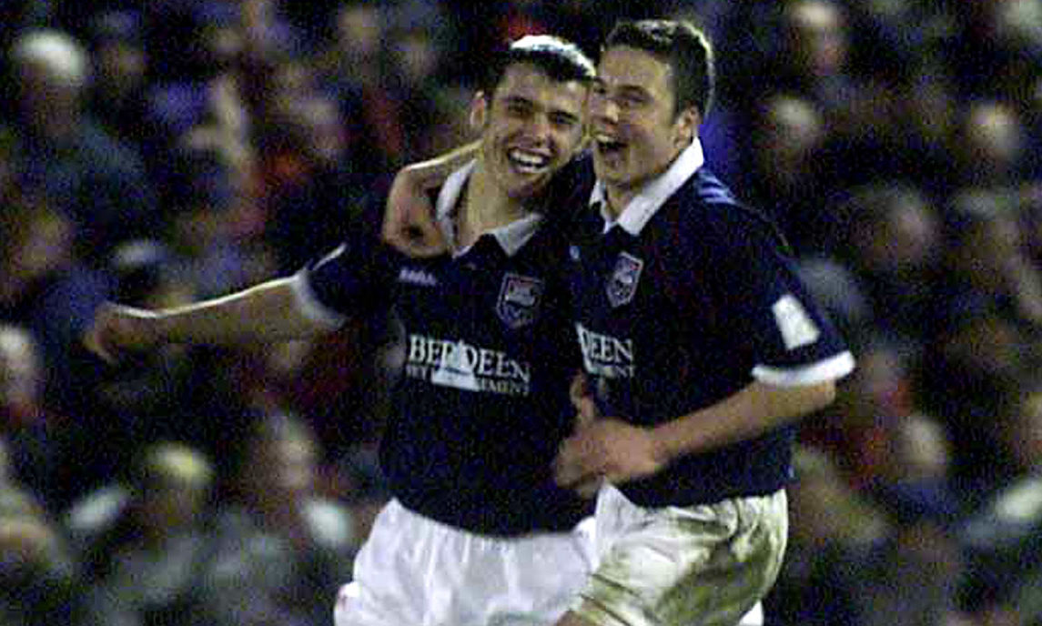 Ross County's Steven Mackay celebrates with Don Cowie during the CIS Insurance Cup, Quarter-final game between Ross County and Rangers at Victoria Park in 2001.
