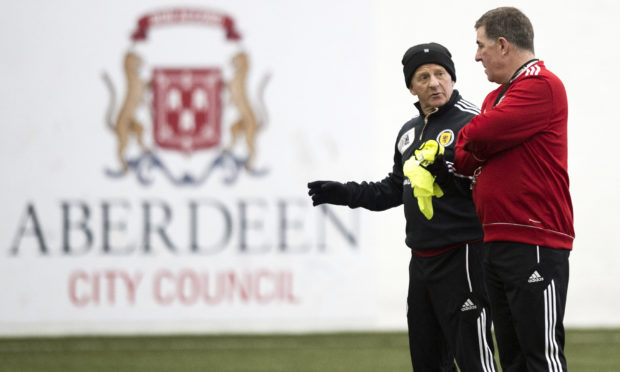 Gordon Strachan speaks to assistant Mark McGhee during their time in charge of Scotland.