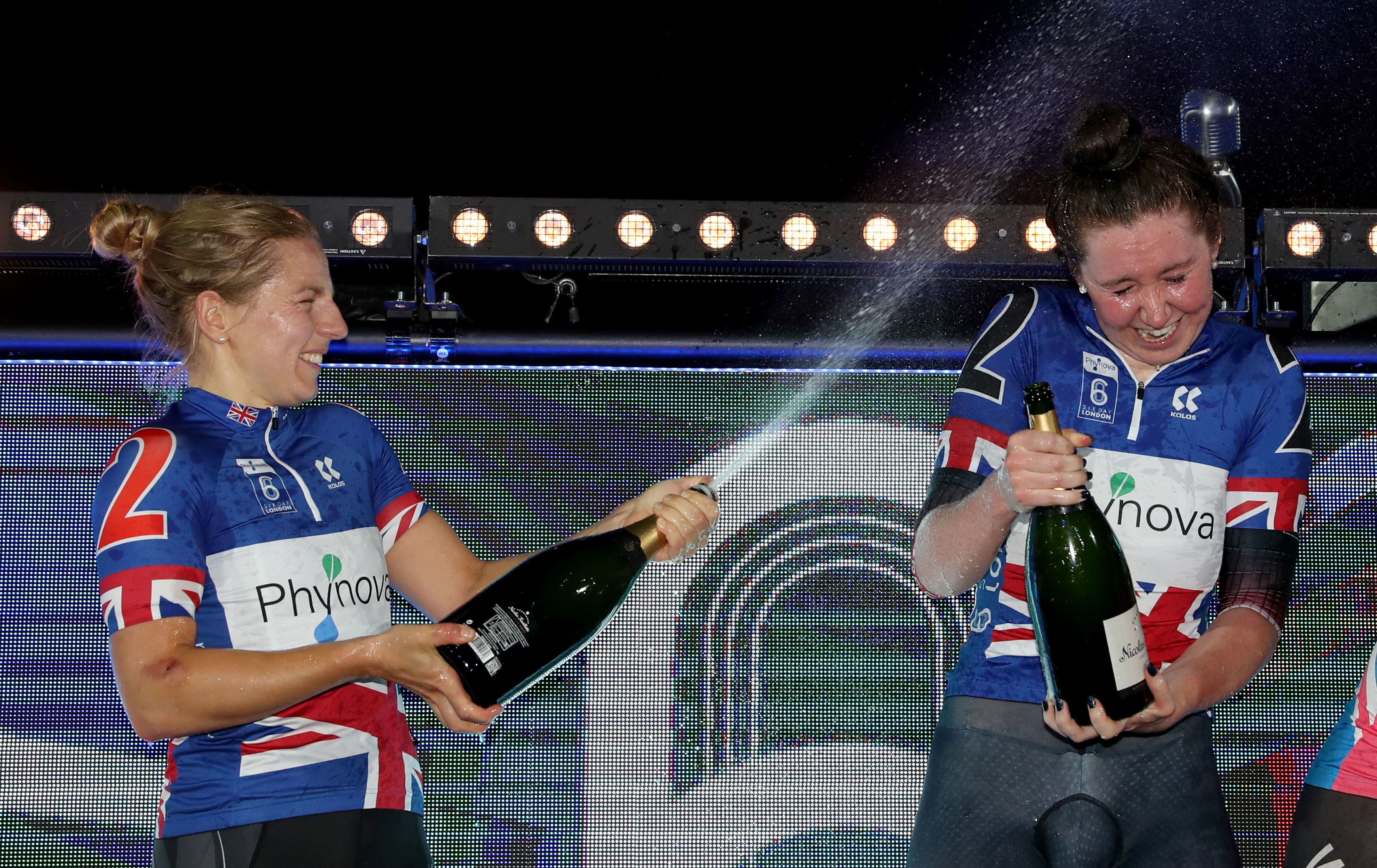 Winners Great Britain’s Katie Archibald and Neah Evans celebrate on the podium during day six of the Six Day Cycling.