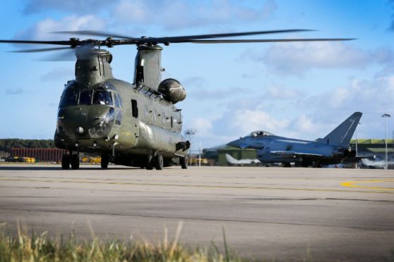 Three Chinook helicopters have arrived at RAF Lossiemouth.