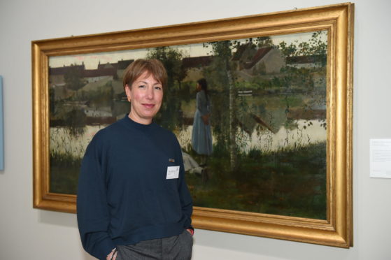 Madeline Ward, lead art curator, with Le Passeur (The Ferryman).
