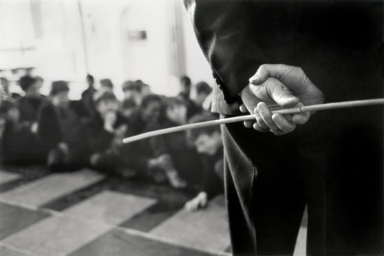 (GERMANY OUT) Great Britain, England, London, Battersea Secondary School, pupils sitting on the floor of the assembly hall, teacher with cane     (Photo by Wolfgang Kunz/ullstein bild via Getty Images)