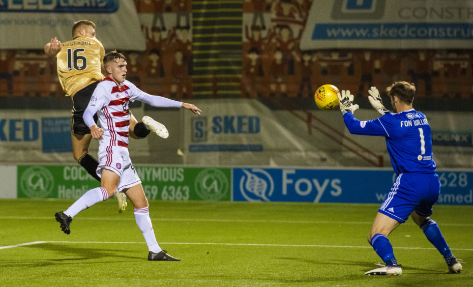 Aberdeen's Sam Cosgrove (left) sees his header saved by Hamilton's Owain Fon Williams.