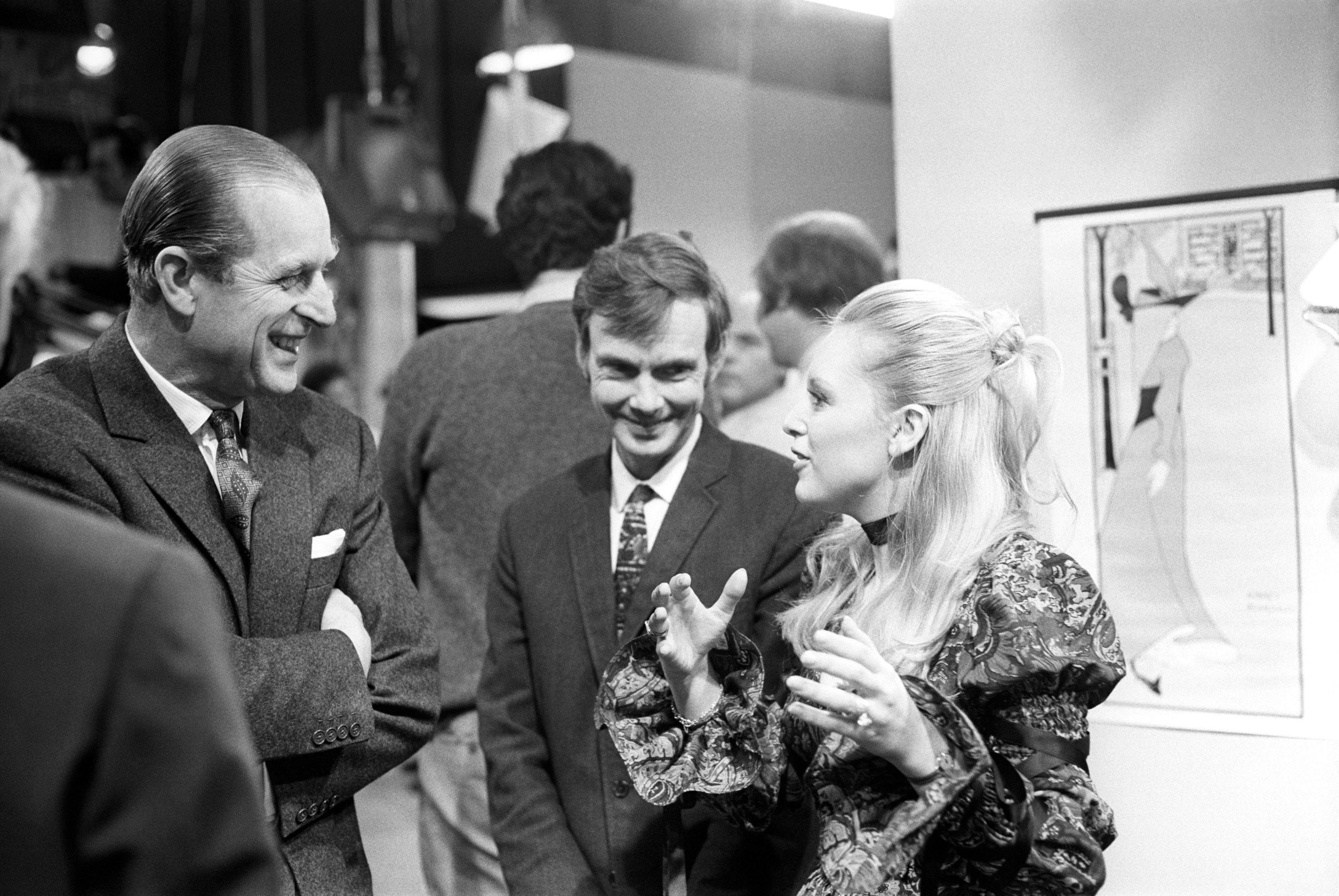 Prince Philip, The Duke of Edinburgh talks to producer, Reg Watson, and actress Jane Rossington during his visit to the set of "Crossroads", at ATV Studios. Miss Rossington plays the role of Jill Richardson in this long running serial.
