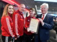 Duncan Skinner right, was chairman of the AFCCT. He is pictured with volunteers from left, Jenna McDonald, Stephen Harvey and Paul Davidson.