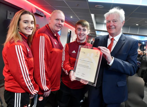 Duncan Skinner right, was chairman of the AFCCT. He is pictured with volunteers from left, Jenna McDonald, Stephen Harvey and Paul Davidson.