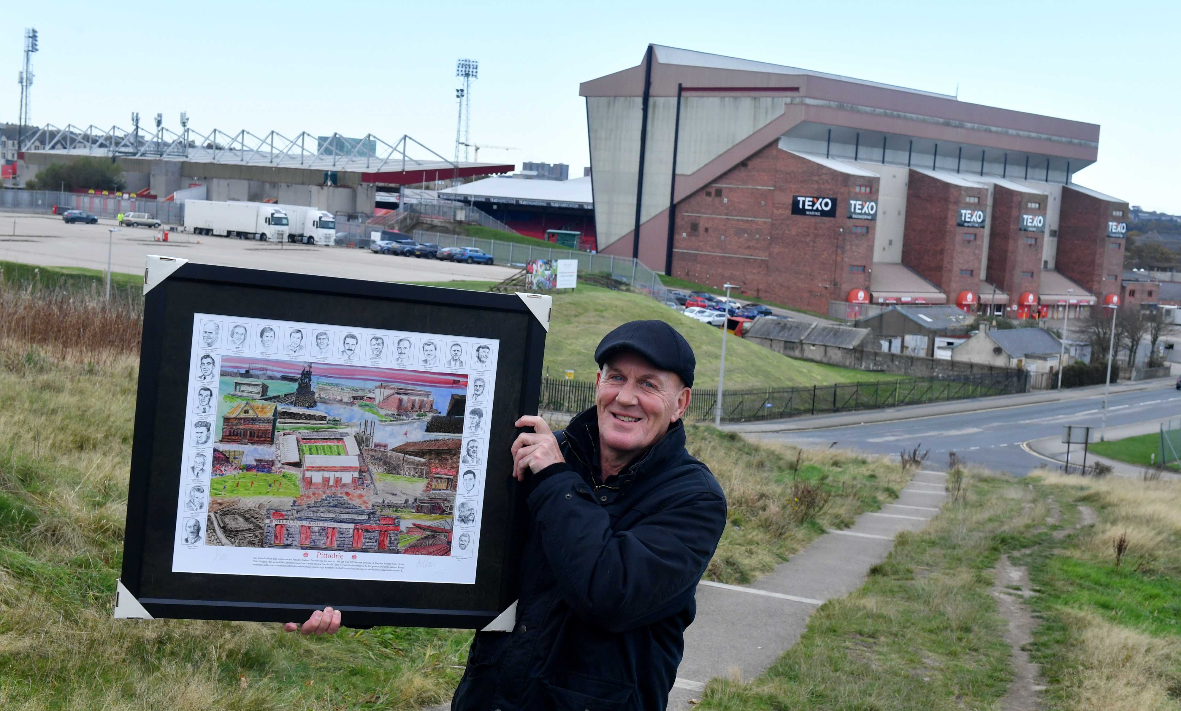 George Dow with his commemorative painting of Pittodrie Stadium.