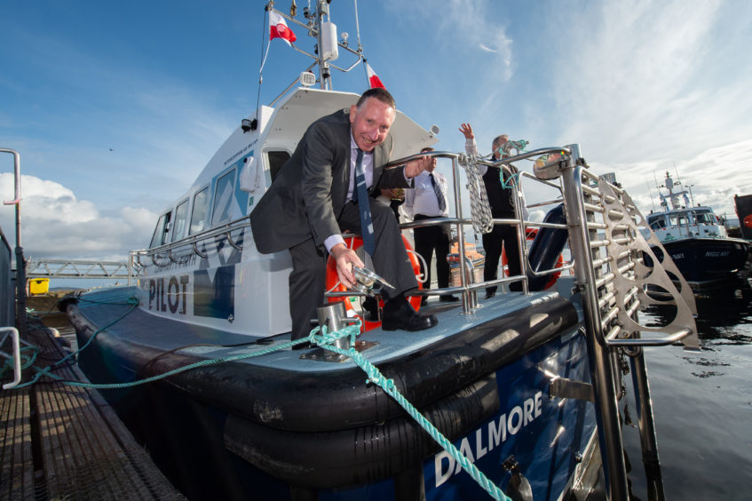 Roger Eddie, vice chairman of the Port of the Cromarty Firth christens the Dalmore
Pictures by Jason Hedges