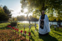 Pictures by JASON HEDGES    
Pictures show the official Garden of Rememberance opening in Inverness today.
Picture:Vicar John Cuthbert wonders through the garden
Pictures by JASON HEDGES