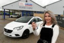 Raffle winner Nicole Anderson collecting her car.