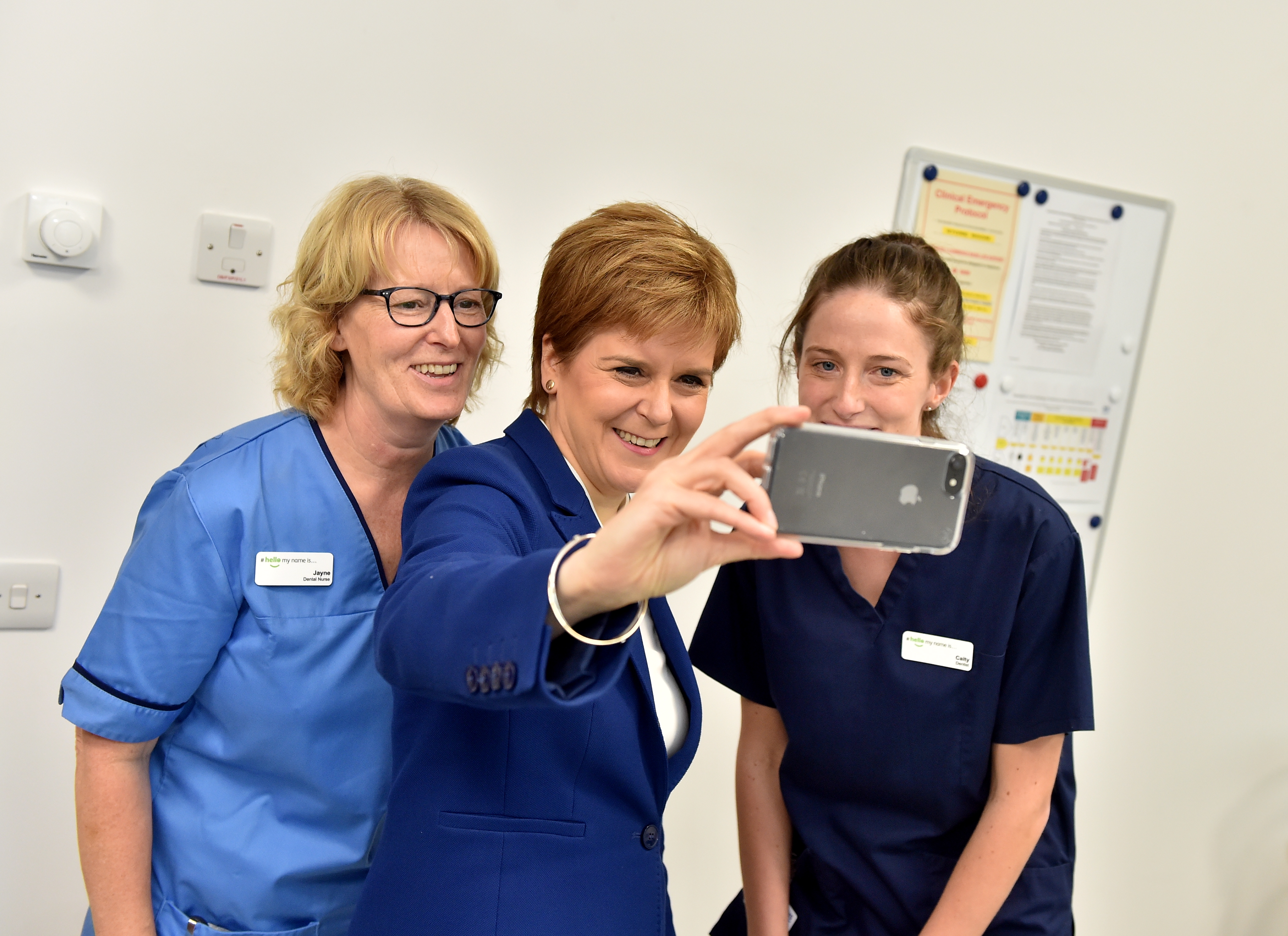 Nicola Sturgeon grabbing a selfie with some people in the hub.
