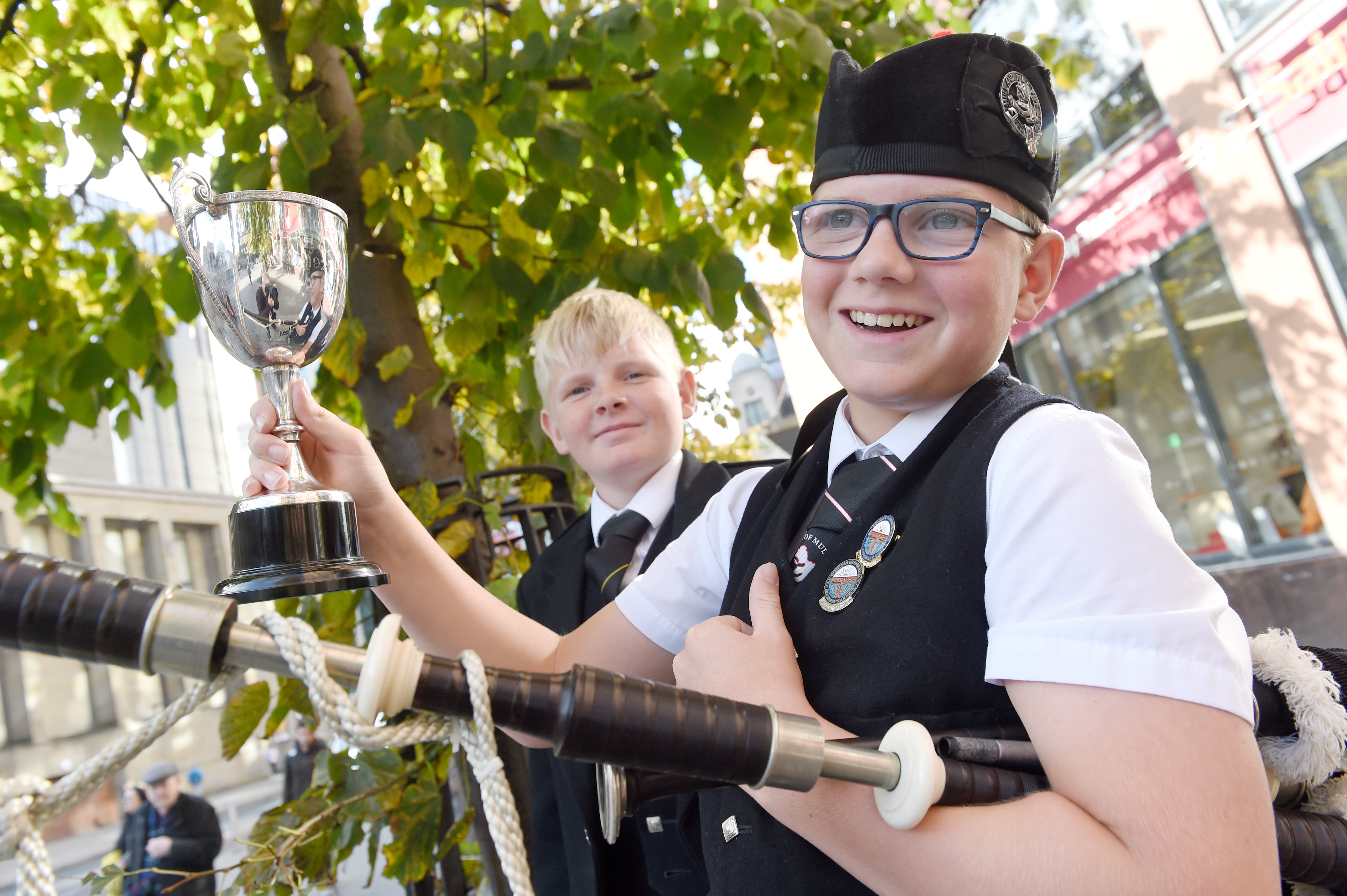 Archie Johnston (right) of Mull with the Roderick Ross, Ferintosh, Memorial Trophy for piping in the under 13 age groups. Also in the photograph is his brother Logie who won the same cup at last years Mod in Dunoon. Picture by Sandy McCook.