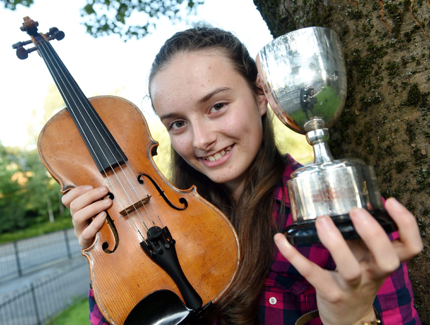 Meredith Kennedy of Glenalmond School with the Robert MacCallum Memorial Trophy for fiddle music in the 13-18 age group. Picture by Sandy McCook