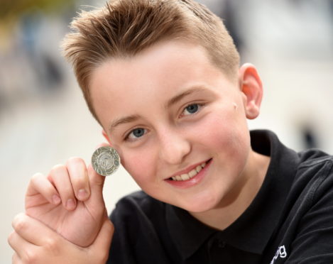 Archie Kennedy (14) of the Lochaline Choir  with the James C MacPhee Memorial Medal for solo singing. Picture by Sandy McCook