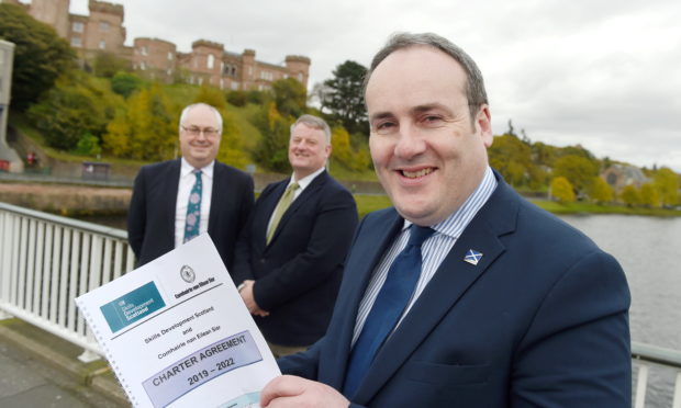 Scottish Government Minister Paul Wheelhouse with Malcolm Burr, Chief Executive of Western Isles Council (left) and Frank Mitchell, Chief Executive of Skills Development Scotland as the agreement was signed in Inverness yesterday. Photo by Sandy McCook
