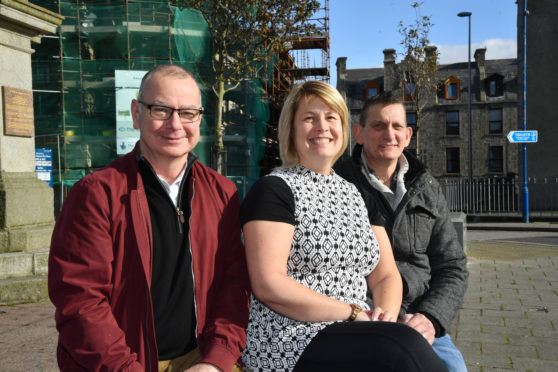 Y SUFFERM IN SILENCE CHAIRMAN PAUL GREENALL (R) WITH VOLUNTEERS AND TRUSTEES BRIAN SILLENCE AND MADGE ANGUS