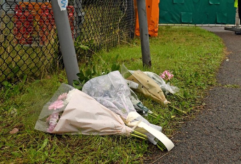 Floral tributes at the Waterglade Industrial Park in Grays, Essex, after 39 bodies were found inside a lorry on the industrial estate.