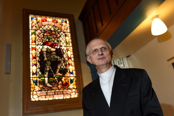 Rev Martyn Sanders held a rededication service for the stained glass window. Picture by Kenny Elrick.