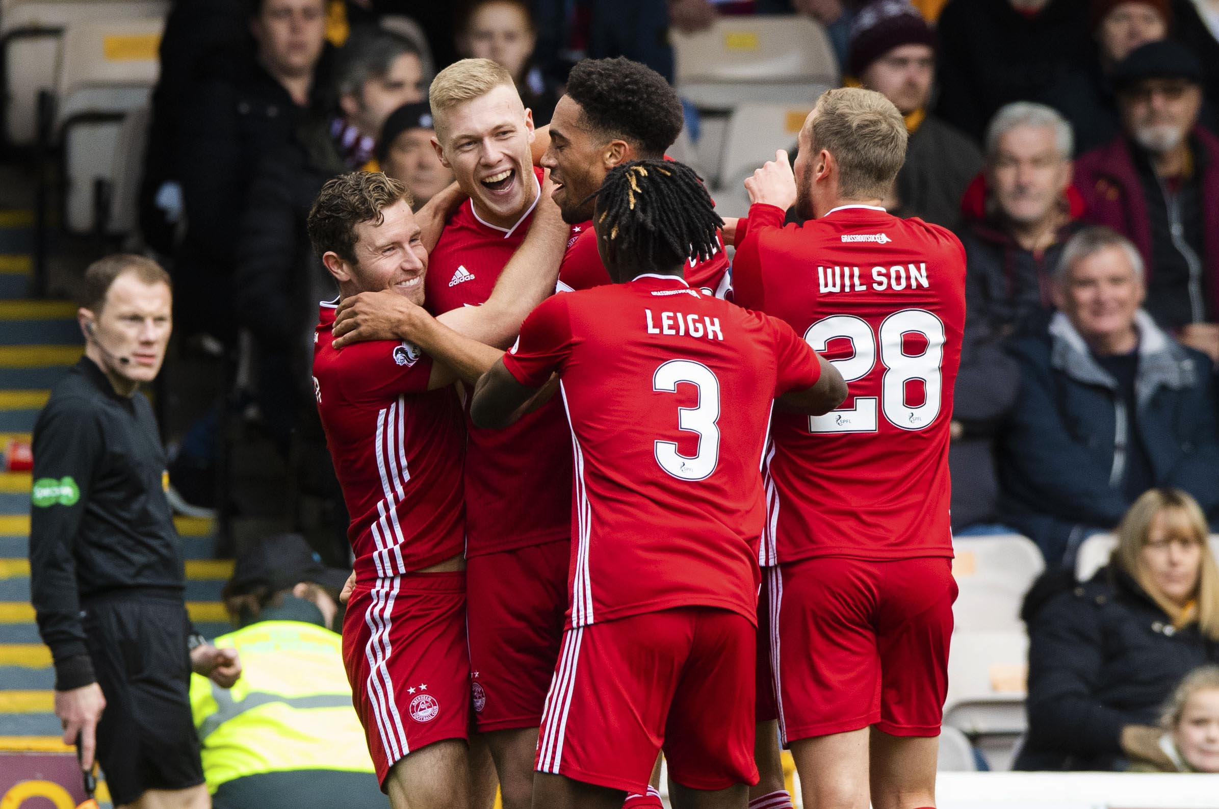 Sam Cosgrove is pictured celebrating with his teammates after making it 1-0 to Aberdeen at Motherwell