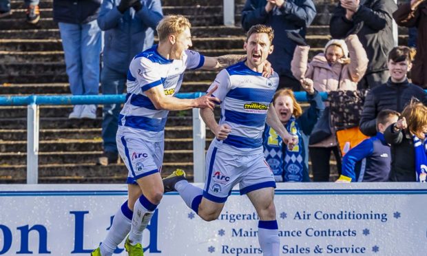 Bob McHugh celebrates scoring for Morton.