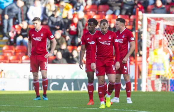 Aberdeen's players stand dejected after conceding the fourth goal