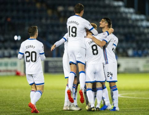 Caley Thistle players celebrate Aaron Doran's goal.