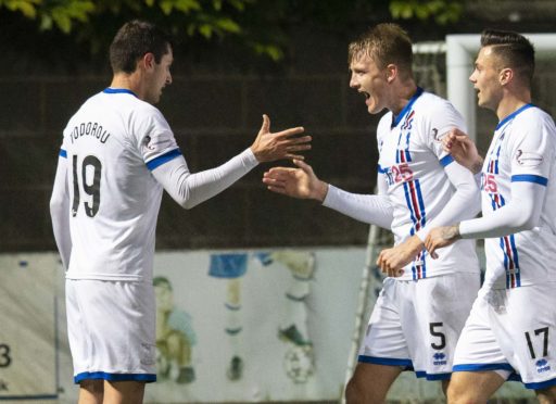 Nikolay Todorov (left) celebrates his goal with team-mate Coll Donaldson during the Ladbrokes Championship match between Queen of the South and Inverness.