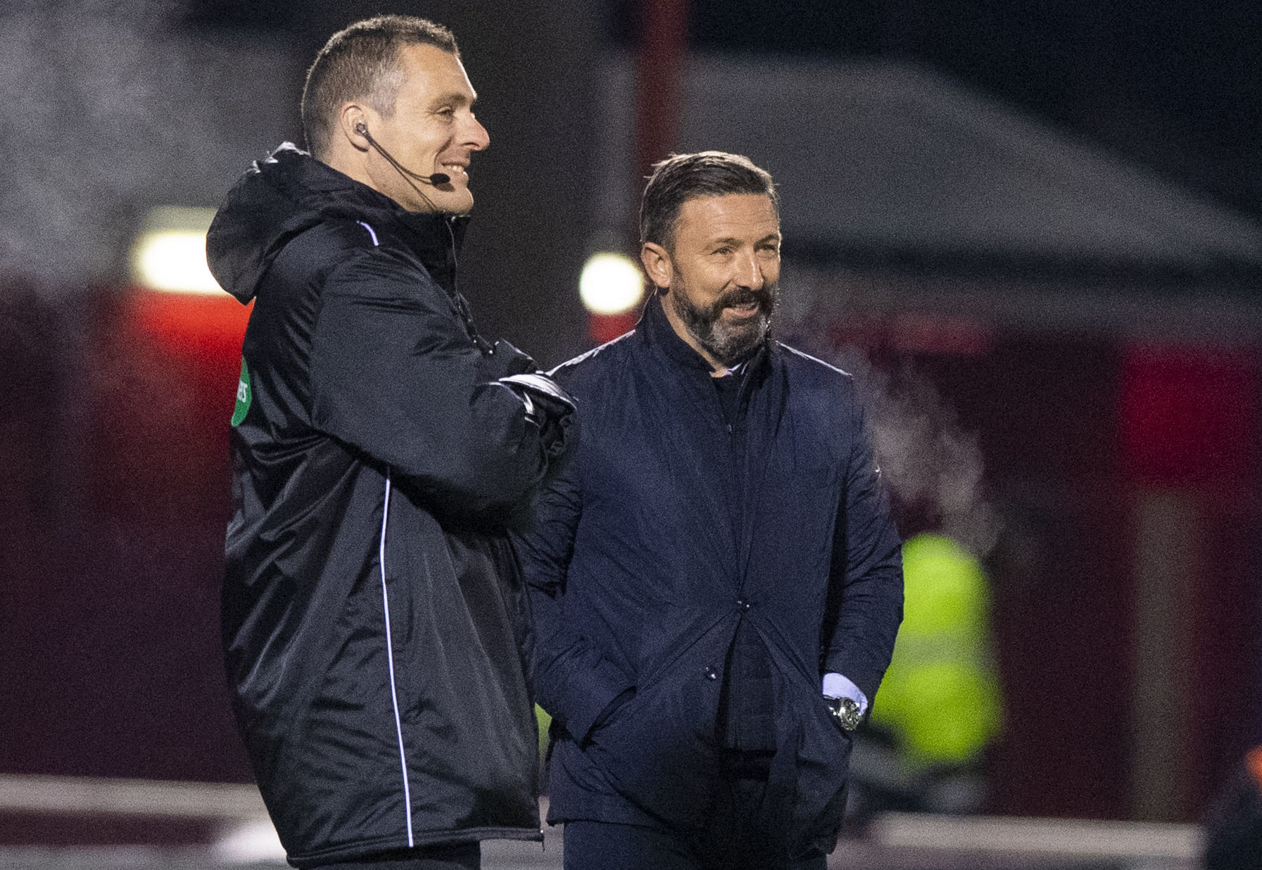 Aberdeen manager Derek McInnes, right, exchanges a joke with fourth official Euan Anderson.