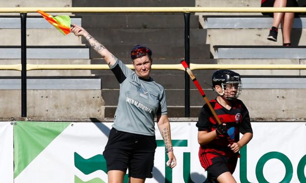 Tina Marshall from Kiltarlity pictured refereeing a match