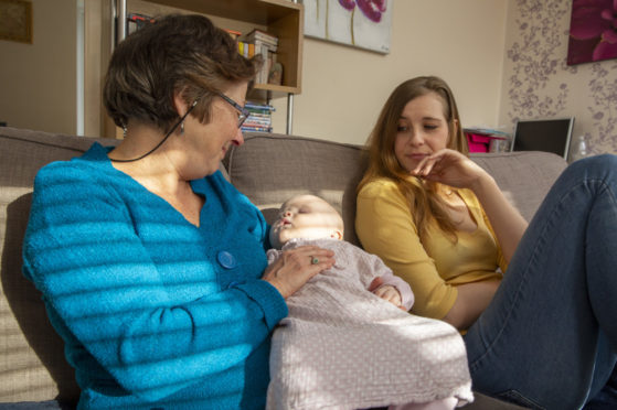 Maria receives support from a Home-Start volunteer Michele with her four children.