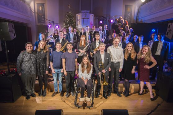 Lucy Lintott flanked by performers from the Let It Snow concert in Elgin