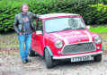 Colin Gibson with his old red Austin Mini from 1987/88.  Colin is organising a charity car run later this month which is beginning from Hazelhead Park, Aberdeen.
Picture by Jim Irvine