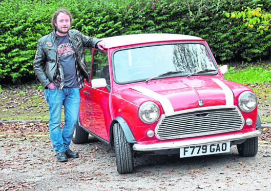 Colin Gibson with his old red Austin Mini from 1987/88.  Colin is organising a charity car run later this month which is beginning from Hazelhead Park, Aberdeen.
Picture by Jim Irvine